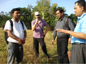 Staff from Oxfam, Thakur from Nepal and Kabir from Bangldesh, discuss the challenges of the appropriate technology to adopt with partners in Cambodia.