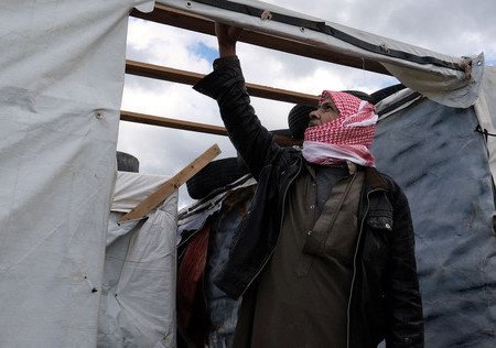Image of Thousands of Syrian refugees battle a winter storm with limited means
