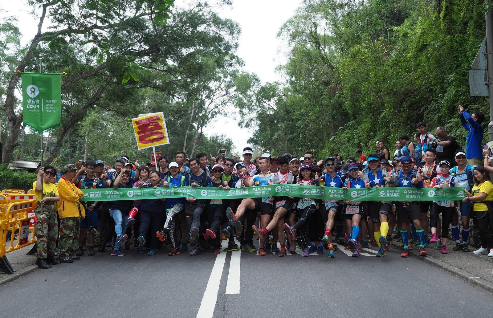 A total of 5,200 walkers are undertaking the 100 km challenge and will trek along the MacLehose Trail and other trails in teams of four within 48 hours. 