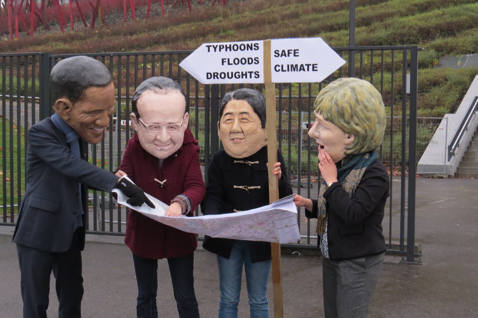 Big headed’ world leaders from Japan, France, Germany, US stand at a fork in the road. Oxfam says world leaders must decide which route they want to take after the fiasco of Warsaw climate talks.
