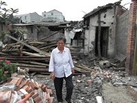  A survivor in Xinshui - at least 109 people have died here, and many remain missing, including this woman's husband