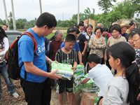 Howard Liu, the director of the China Unit of Oxfam Hong Kong, distributing milk in Xiushui - the priority is for children, elderly people and women. Oxfam is distributing over 250,000 packets of milk in a dozen or so areas of Sichuan, including five Muslim communities.
