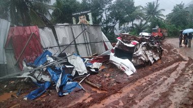 In areas where the water has subsided, cars and advertising signs that were washed away by the flood can be found along roadsides. (Photo: Oxfam India)
