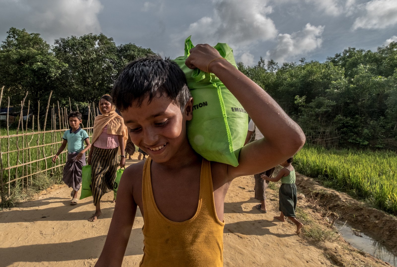 Oxfam distributed food parcels, which included three kilograms of flattened rice and one kilogram of sugar. This can last us two days. Today we will cook potatoes with rice for dinner,’ said Mohammad. (Photo: Tommy Trenchard/Oxfam)