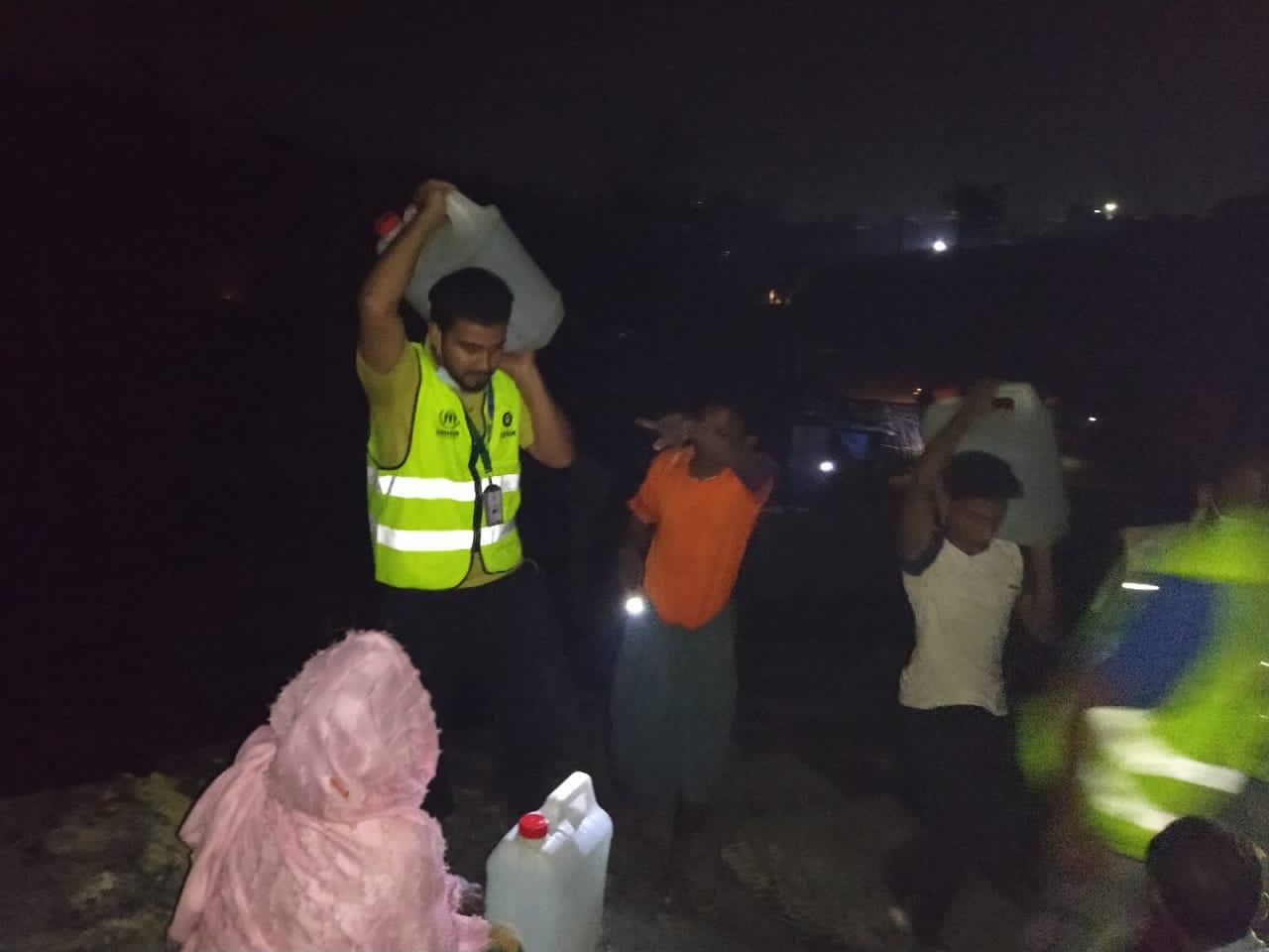 Oxfam's Rapid Response Team also transported water in jerry cans to refugees in areas that the water trucks could not reach. (Photo: Oxfam)