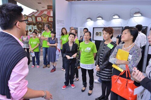 The curator of the ONE-SEVENTH Exhibition Manfred Yuen was introducing his exhibition to the officiating guests.