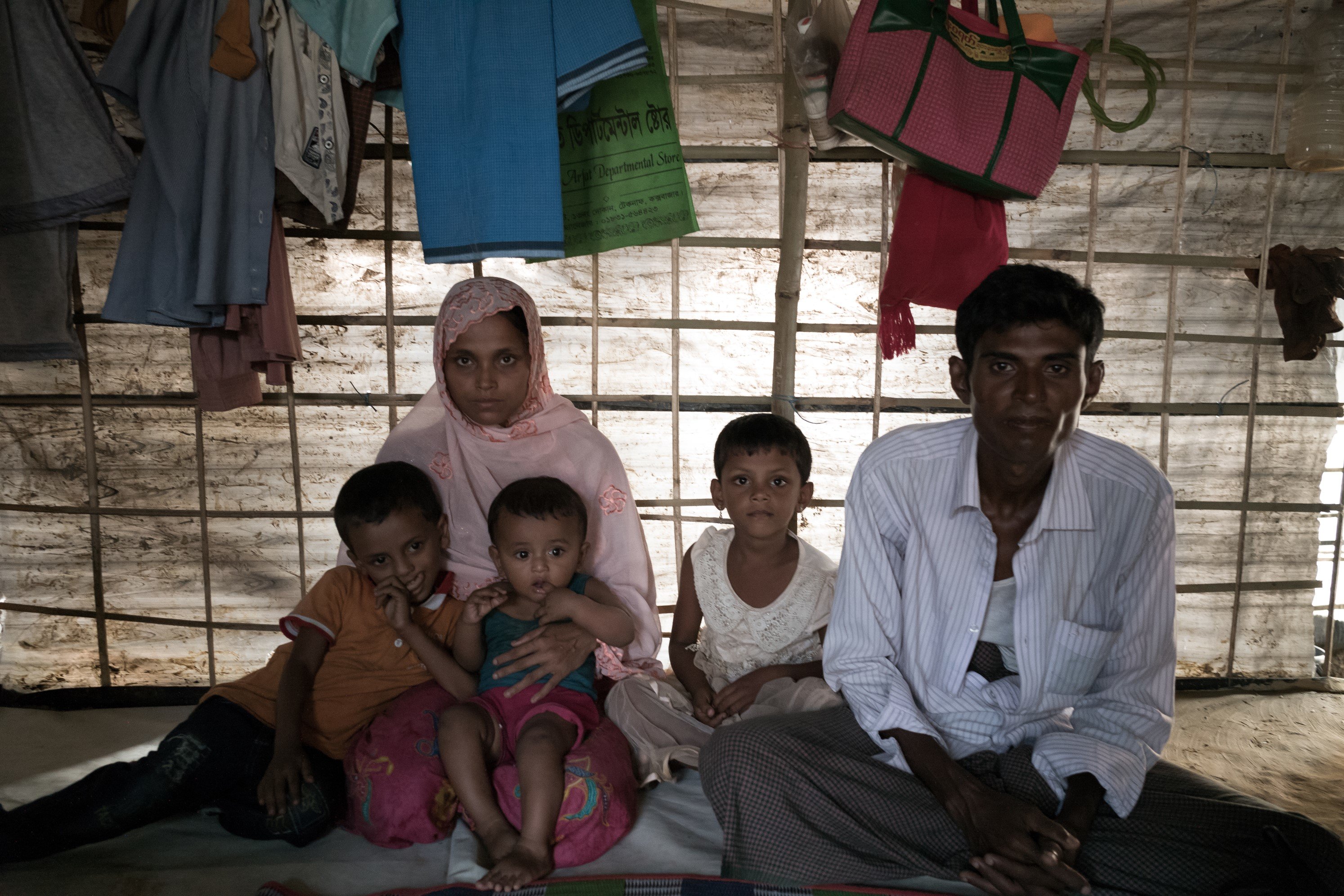 Khaleda, his wife and three children inside their tent.