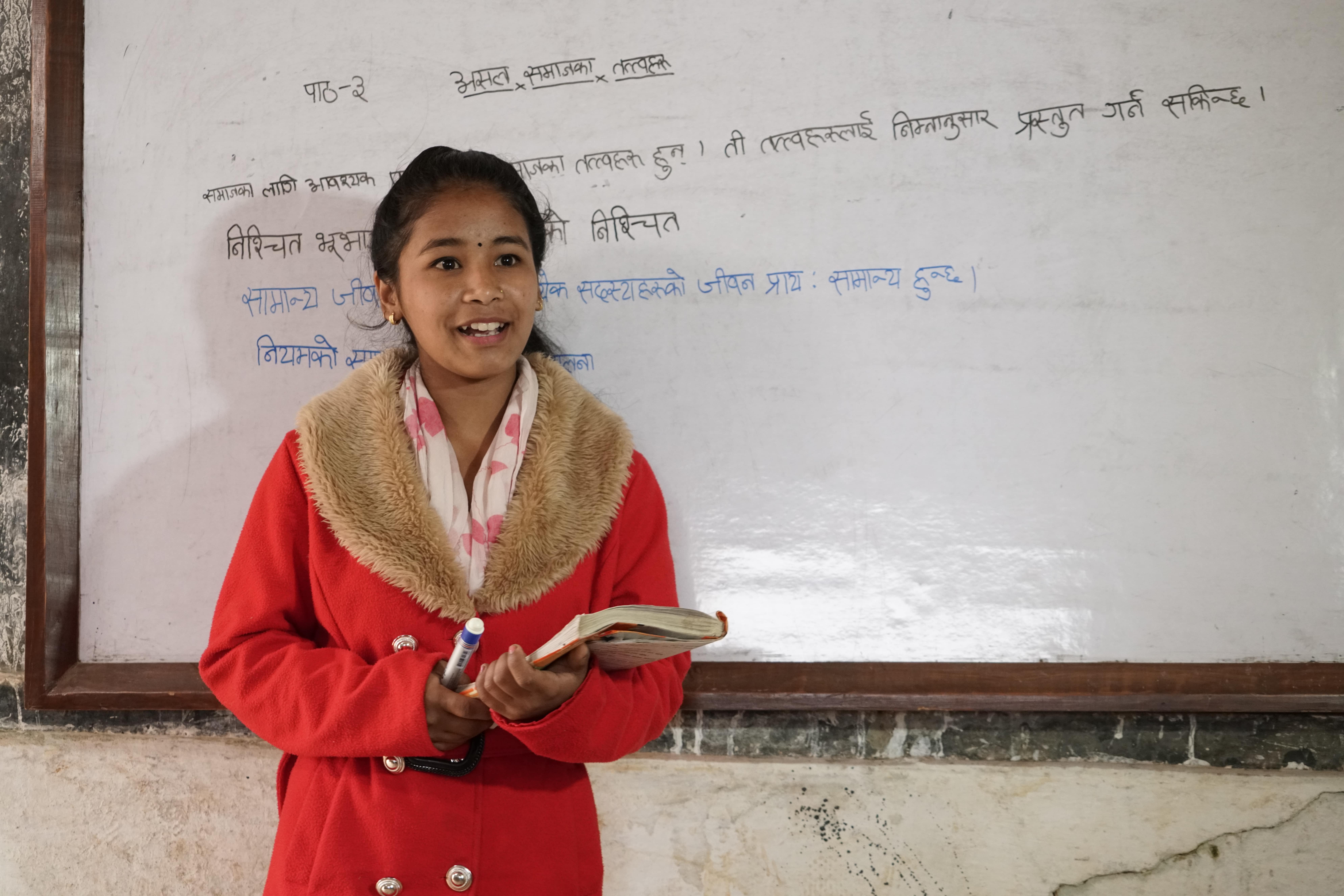 Mira, 16, lives in a village in Nepal’s Arghakhanchi region, and has loved school since she was a child; she’s always dreamed of teaching Nepalese. (Photo: Tony Leung / Oxfam)